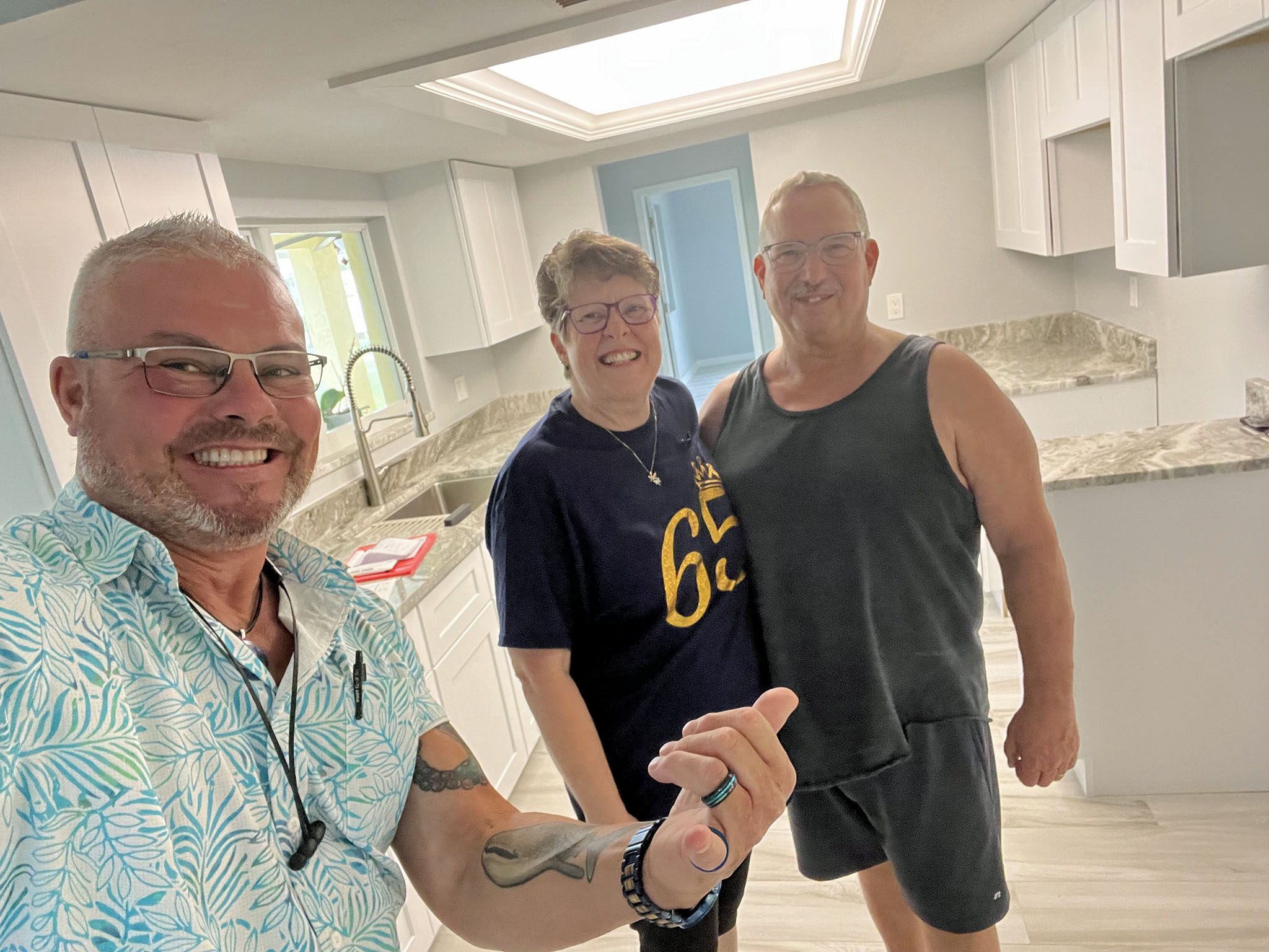 Paul, the Hawaiian Contractor, with his happy homeowner clients at the final walk-through.